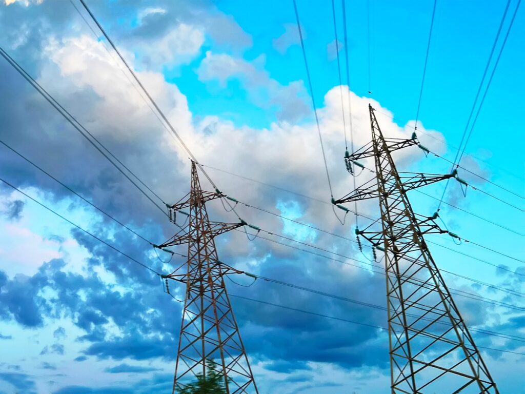 energy power lines blue sky clouds