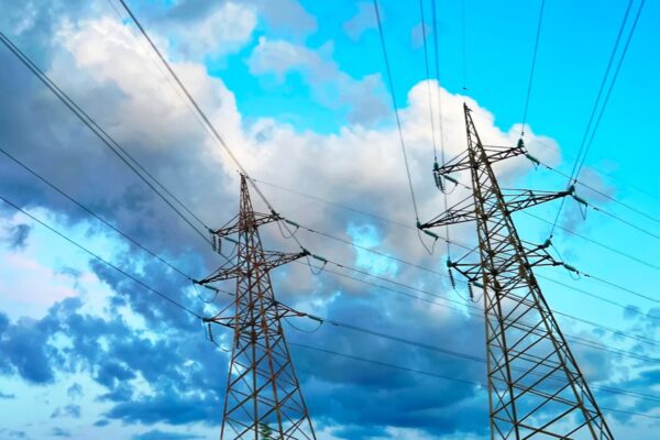 energy power lines blue sky clouds