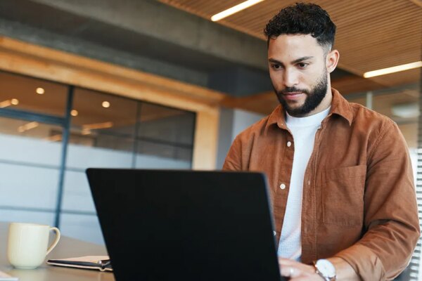 man working on laptop computer