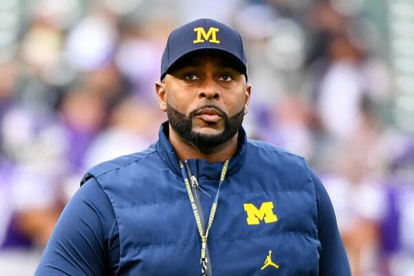 sherrone moore michigan northwestern looks on