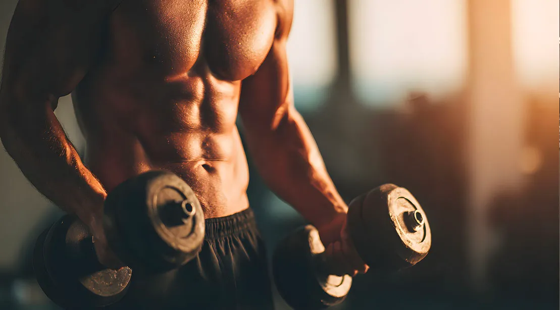 Fit and athletic man using Reps in Reserve Training principle to build a muscular physique.jpg