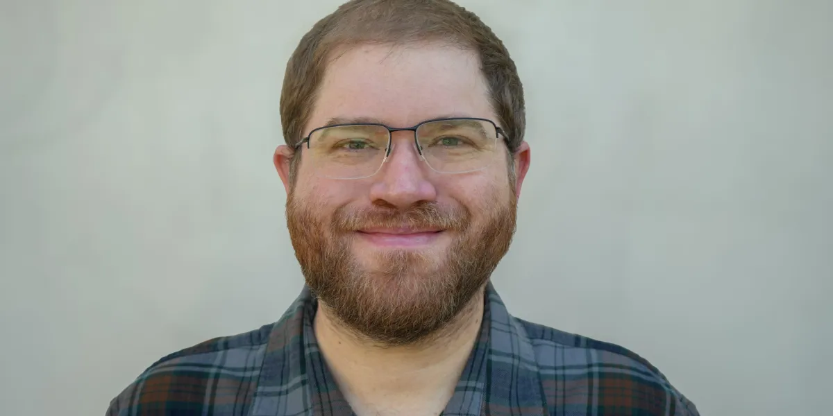 Miles Headshot e1768432371276.jpeg