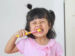 depositphotos 60244573 stock photo girl smiling while brushing her 300x225.webp.webp