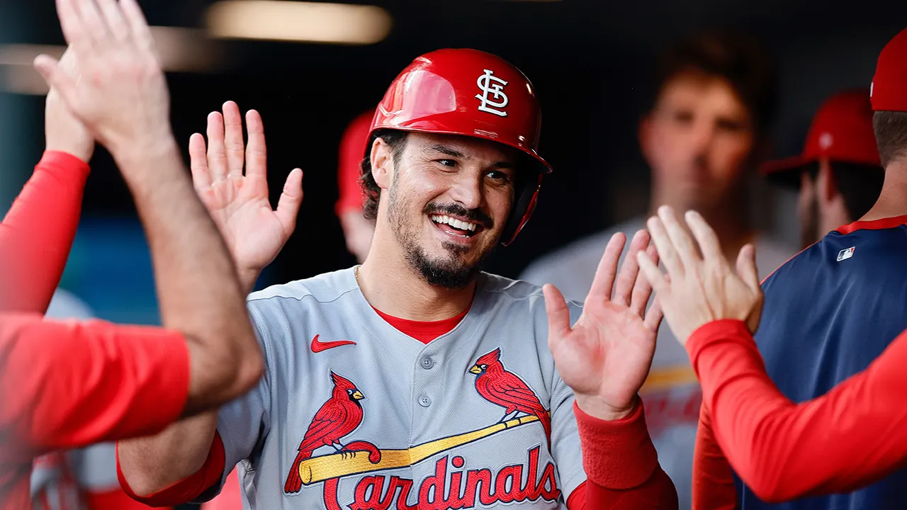 nolan arenado celebrates dugout cardinals rockies.jpg