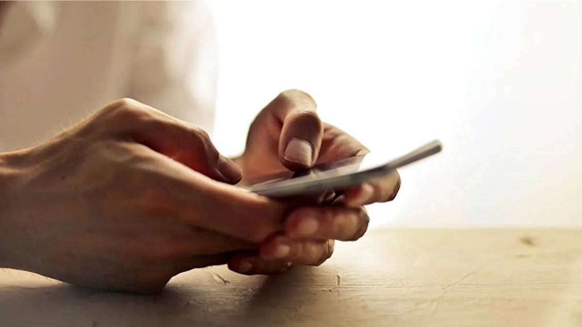 person holds phone.jpg