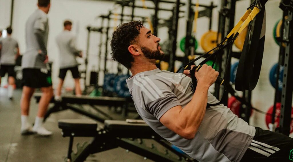 MLS player Cristian Roldan training for the World Cup 2026 using TRX bands.jpg