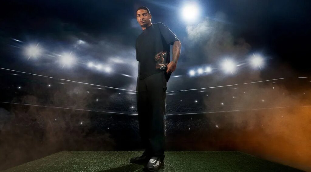 NFL player JaMarr Chase standing in the stadium wearing his new fashion line from Fabletics.jpg