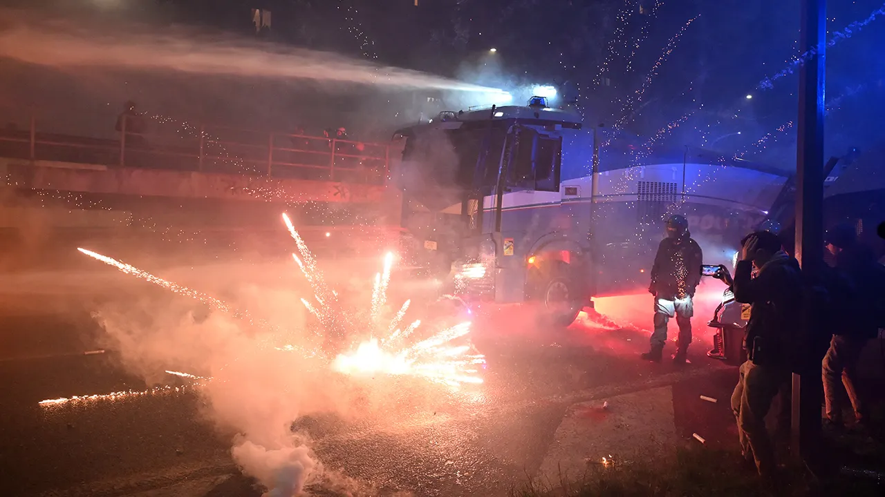 fireworks explode at milan cortina olympics protest.jpg