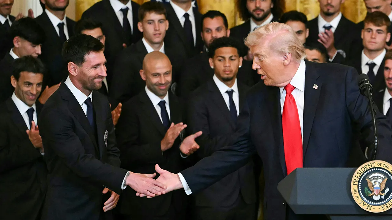 trump handshake messi 3526.jpg