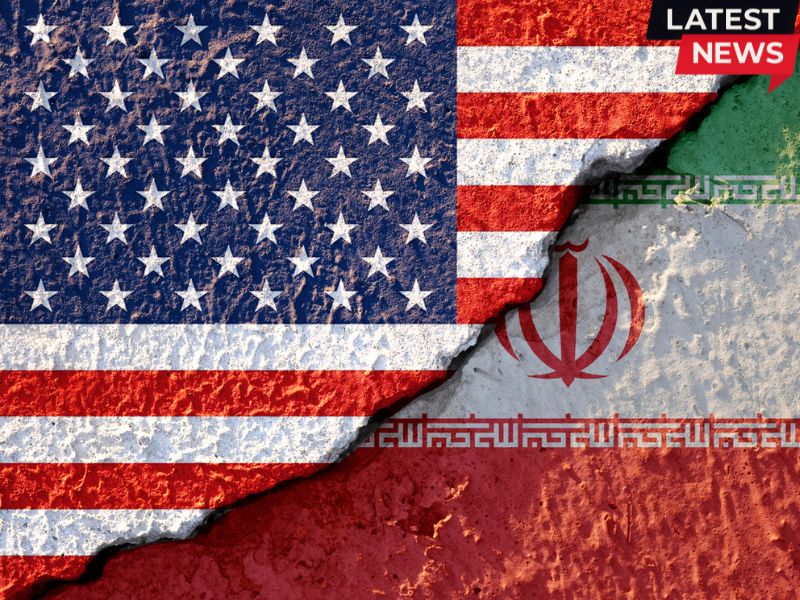 USA flag and Iran flag on cracked wall.jpg