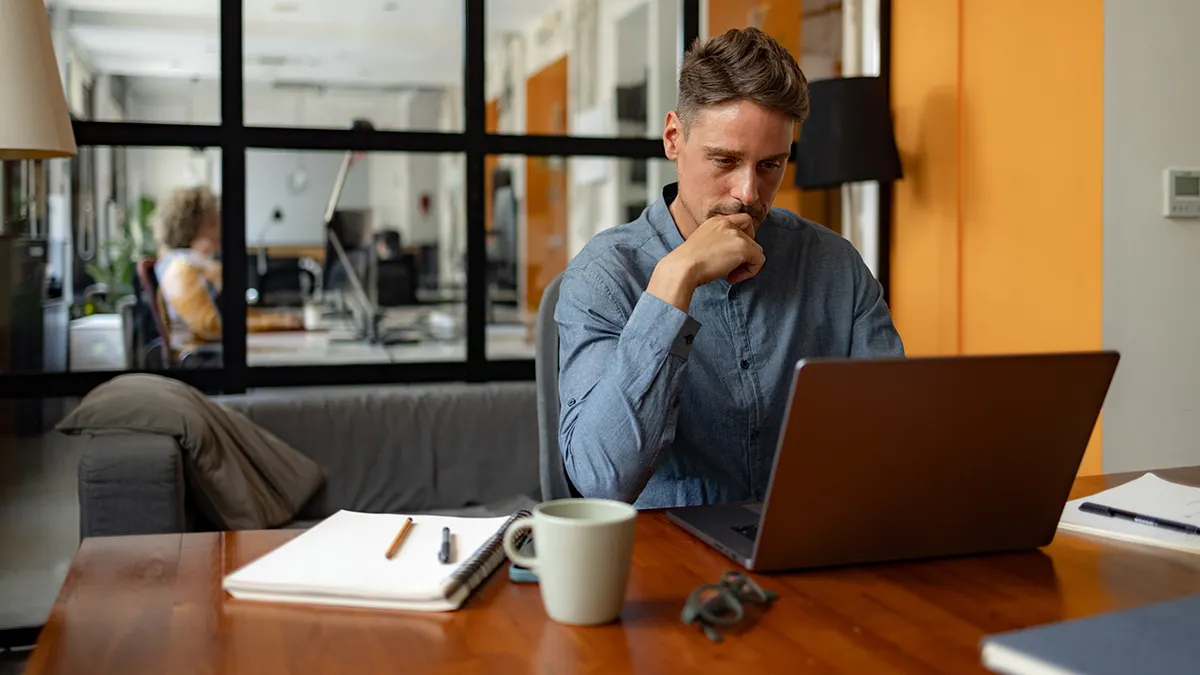 man sitting at desk.jpg
