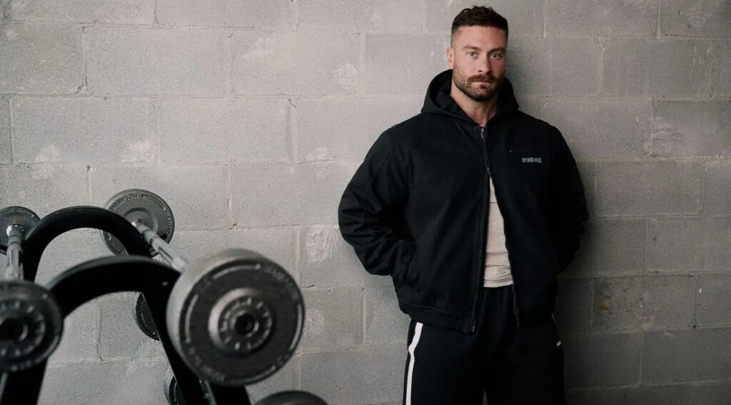 Bodybuilder Chris Bumstead wearing clothes from his collection from GymShark.jpg