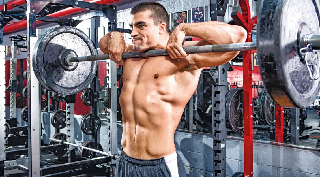 Bodybuilder Working Out His Shoulders With Upright Rows Exercise.jpg