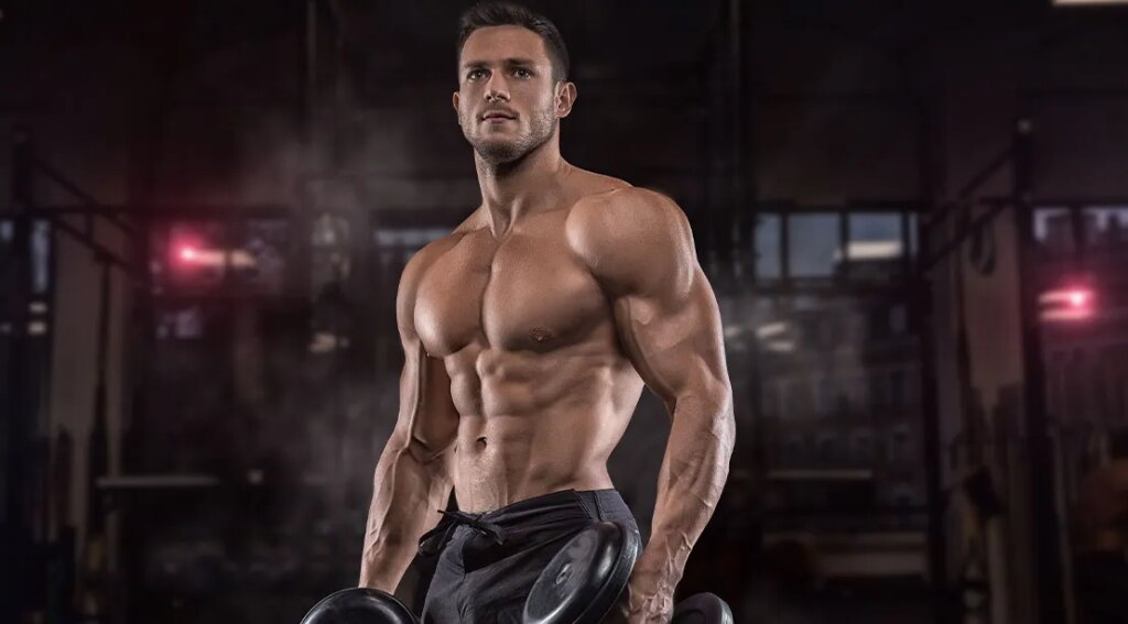 Young muscular athlete using a Science Backed Dropset Strategy to build muscles.jpg