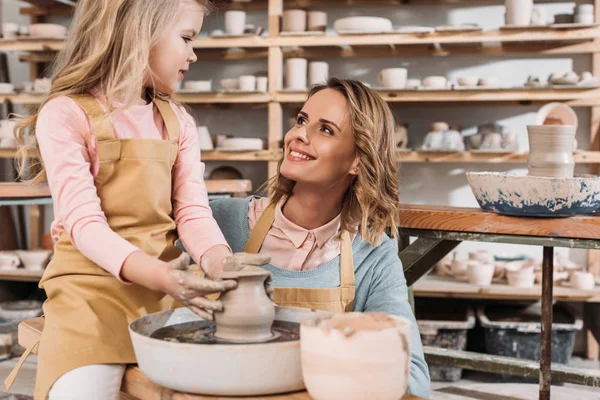 depositphotos 189410448 stock photo female teacher child making ceramic 1.webp.webp
